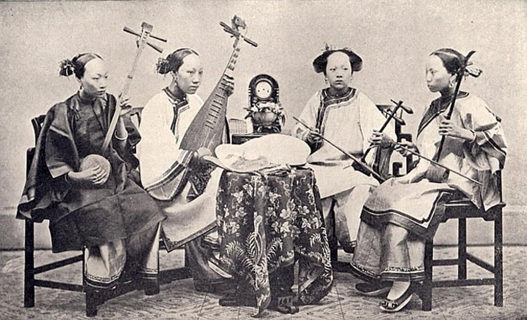 a crowd of people standing around a stage