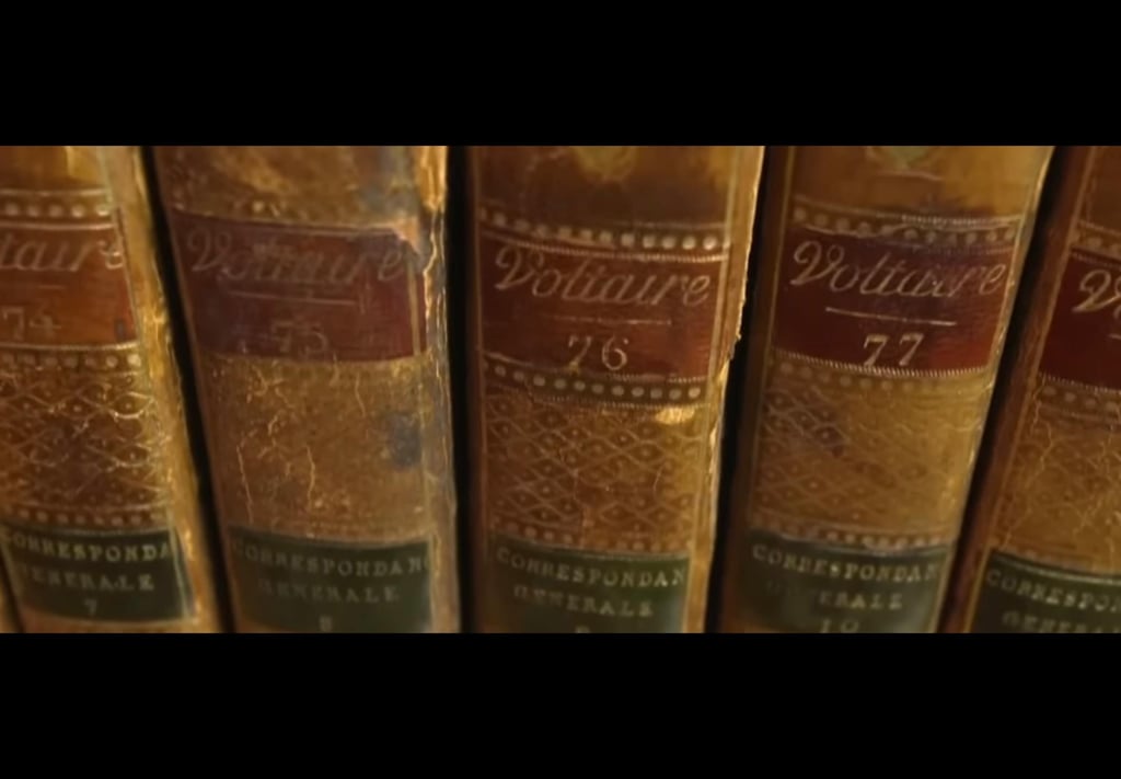 a row of books sitting on top of a shelf
