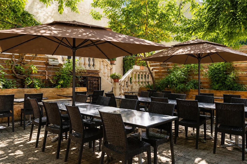 a group of people sitting at tables outside of a restaurant