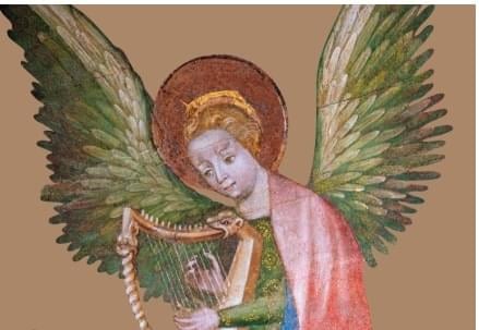 a statue of an angel holding a guitar