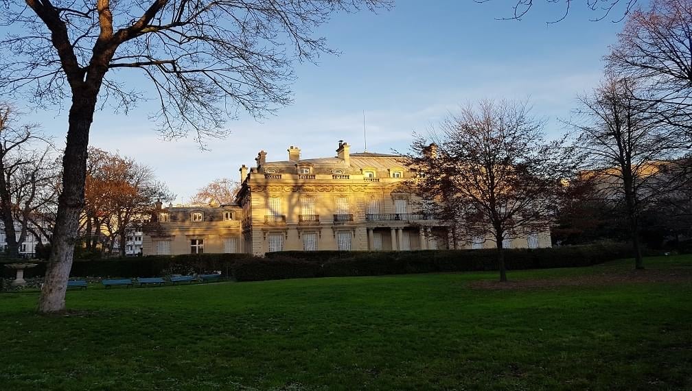 a sign hanging from the side of a building