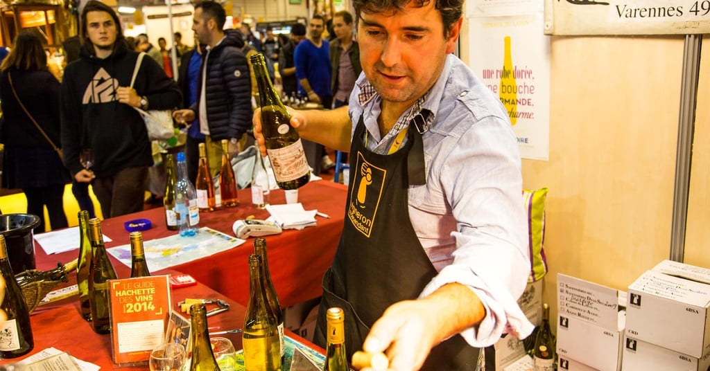 A dining room with a table and chairs
