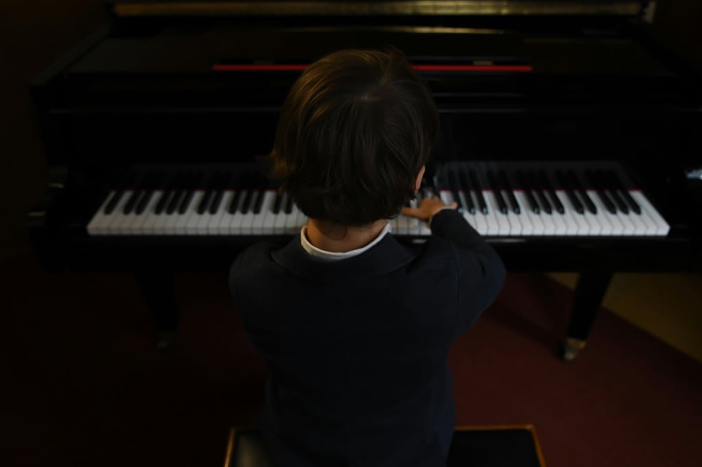 boy during a warm-up before a piano concert