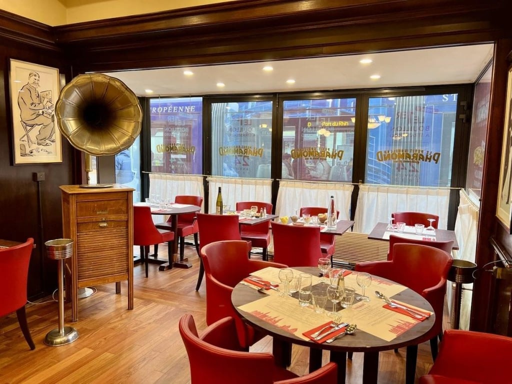 A pastry, sauce, and drinks are ready to be enjoyed.