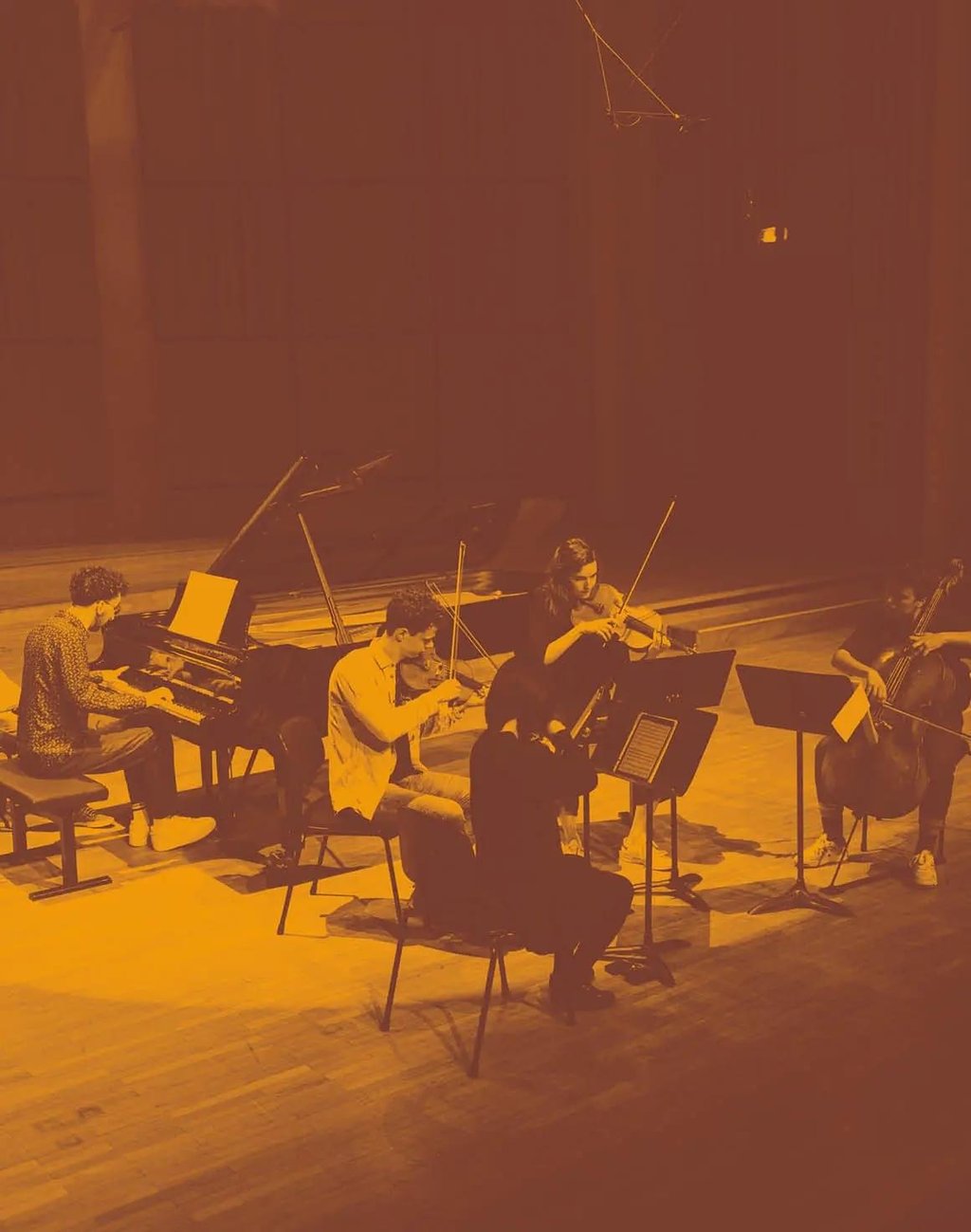 A concert stage illuminated in red light.