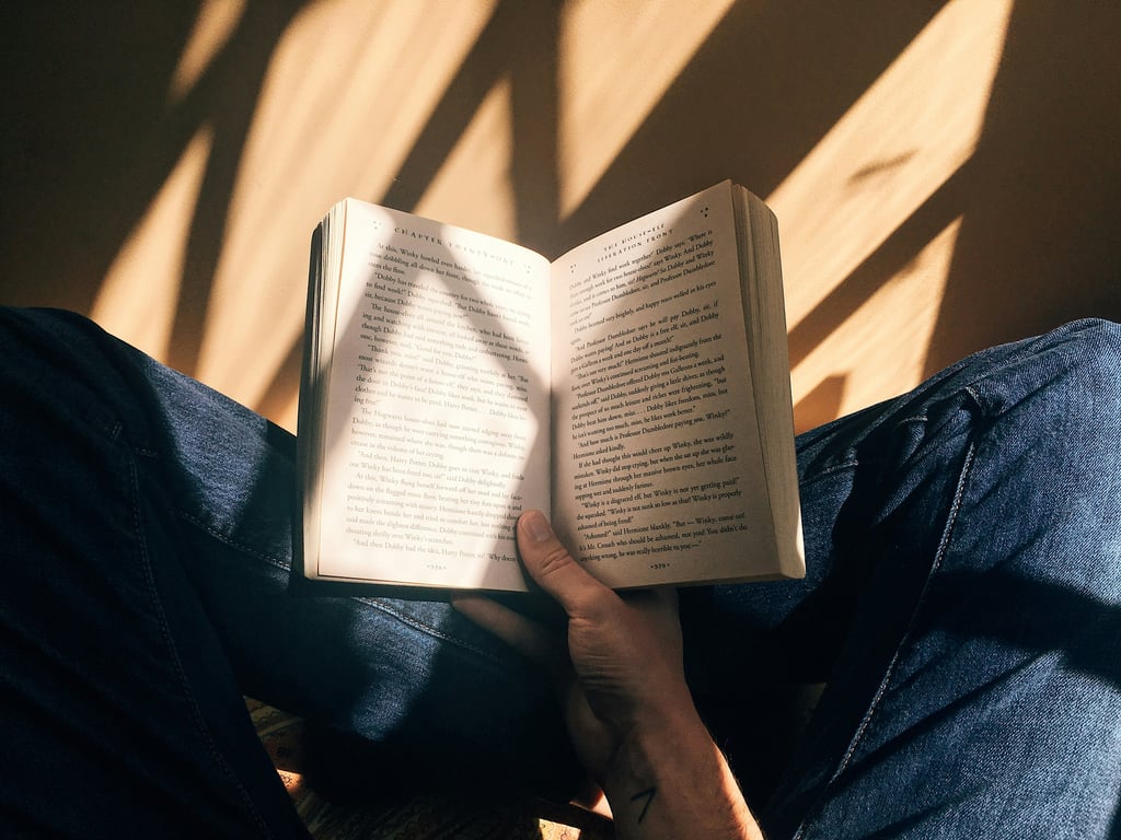 a book open to a page with a page that has a picture of people on it