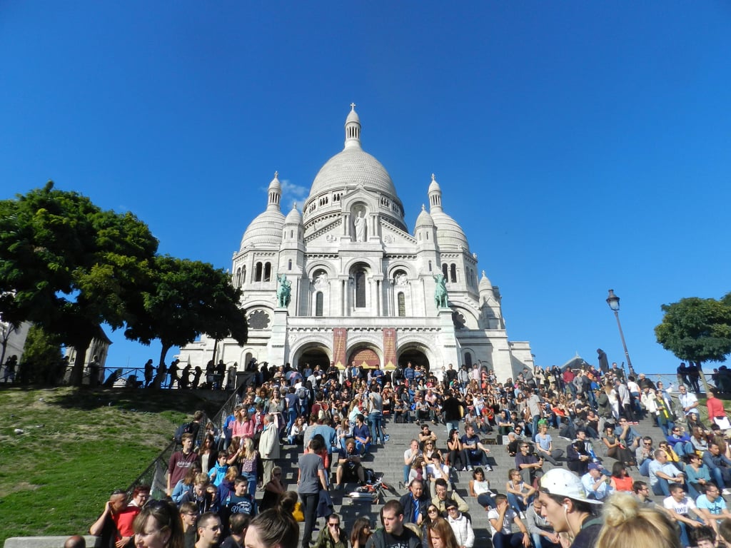 A view of a city with a church on top of it