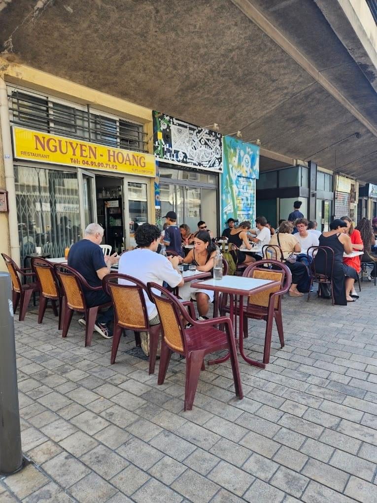 a row of tables outside of a restaurant