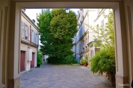 Paris streetview Montmartre cafe with pink flowers