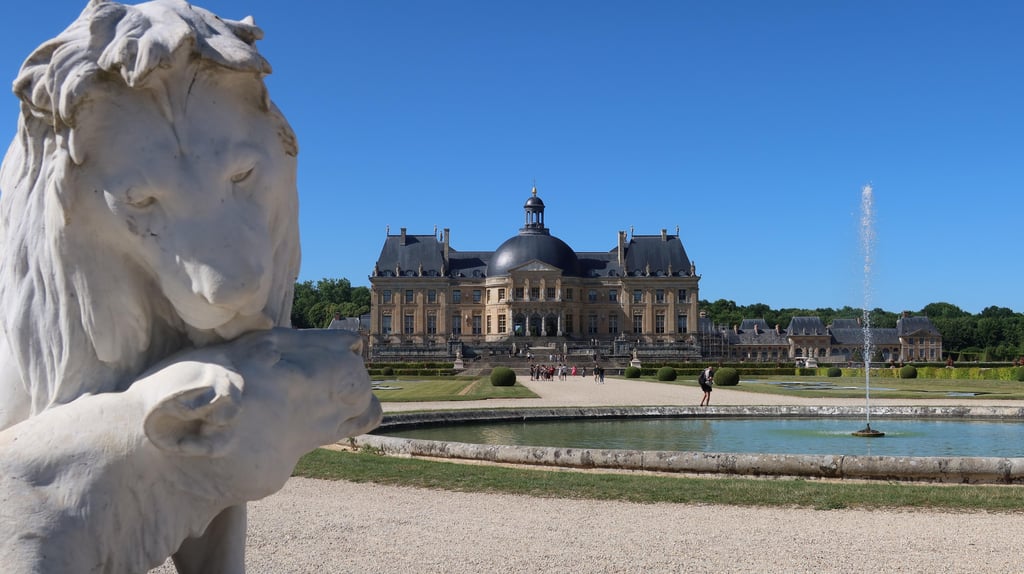 a large building sitting next to a body of water