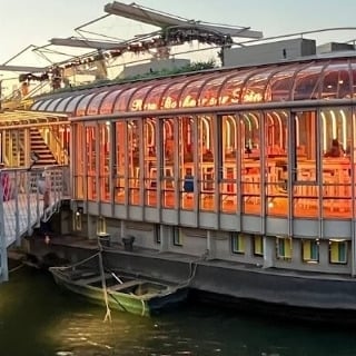 a bridge over a river with boats on it