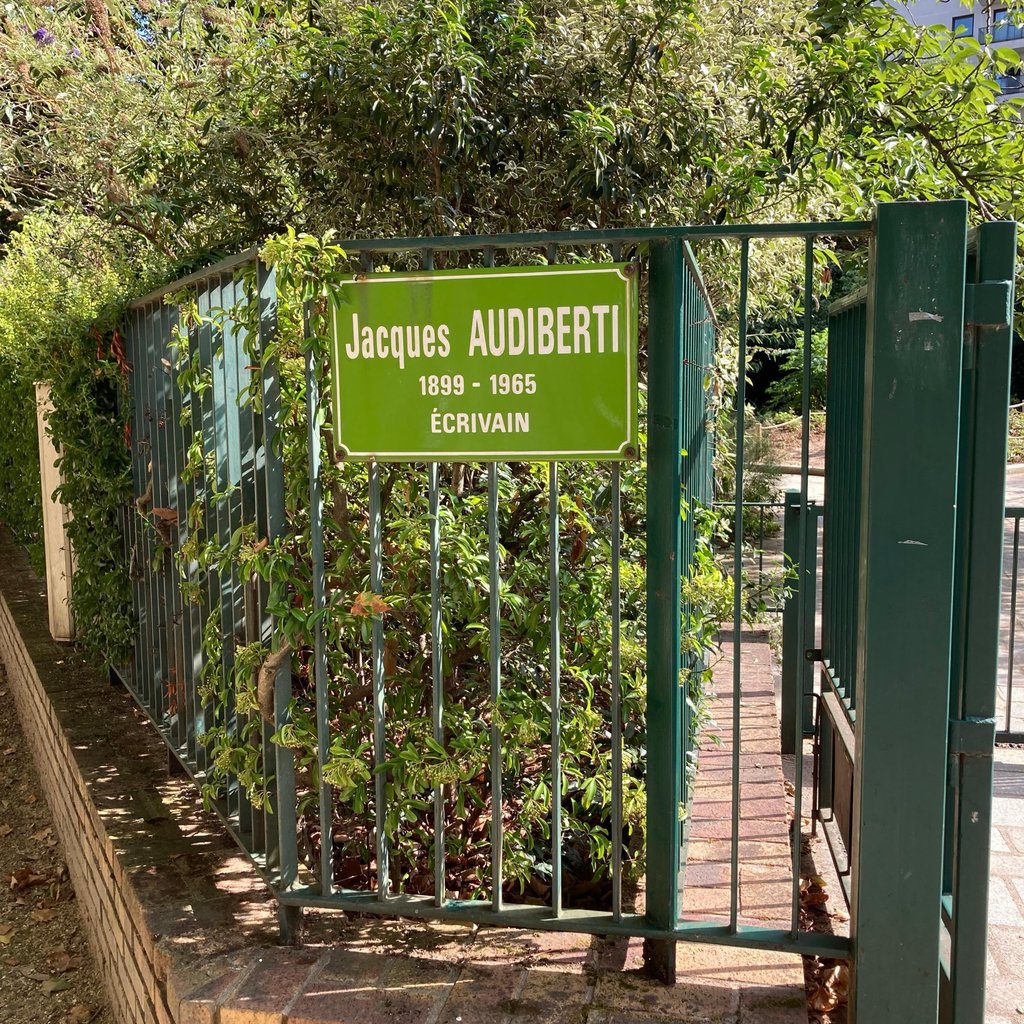 a building with a tree in the front