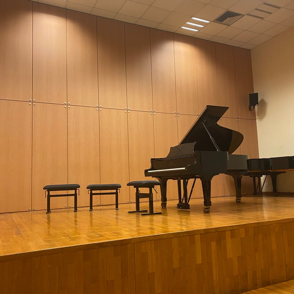 A large white boat floating on top of a body of water