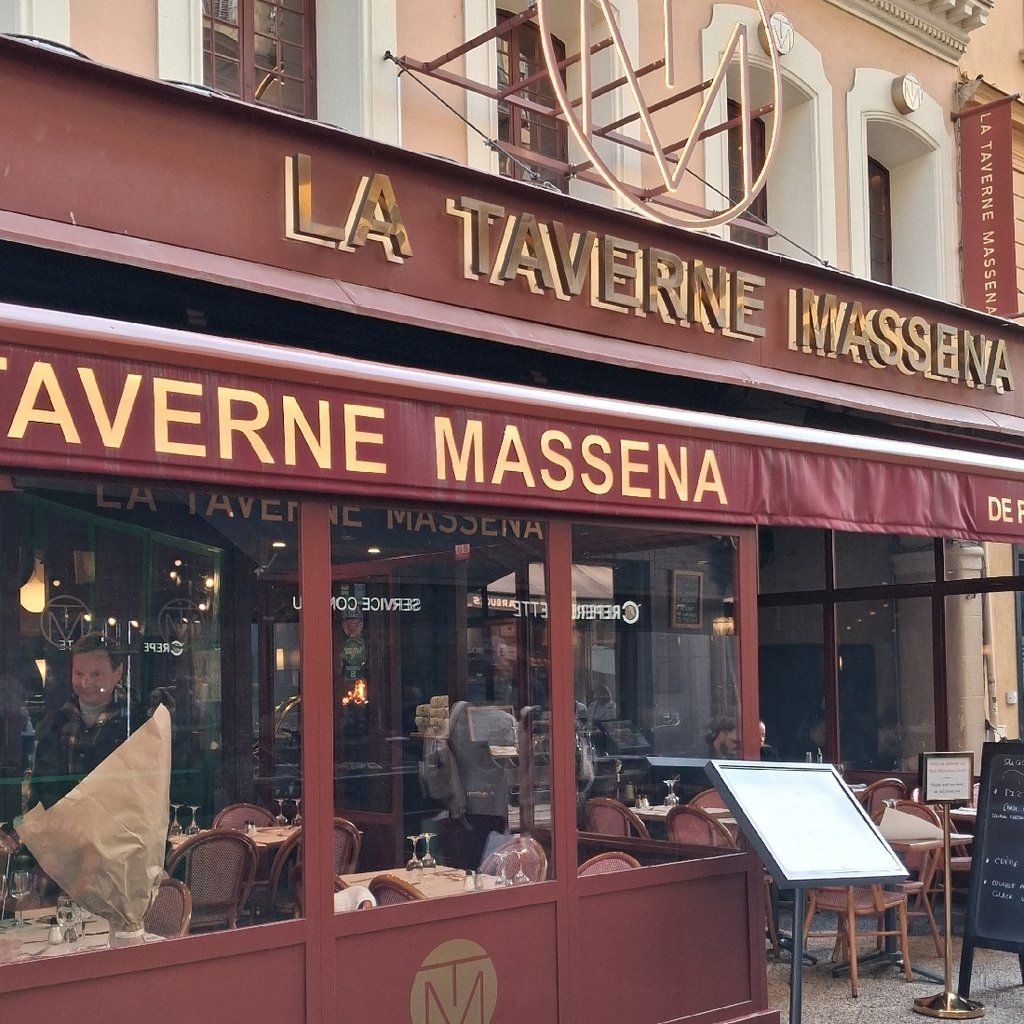 Pizza baking in a wood-fired oven with glowing embers