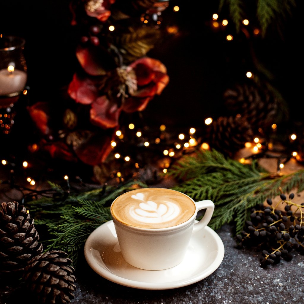 A group of people sitting at tables in front of a building