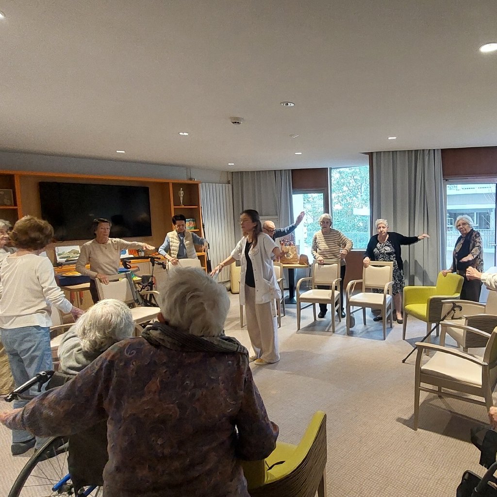 a group of people sitting on mats
