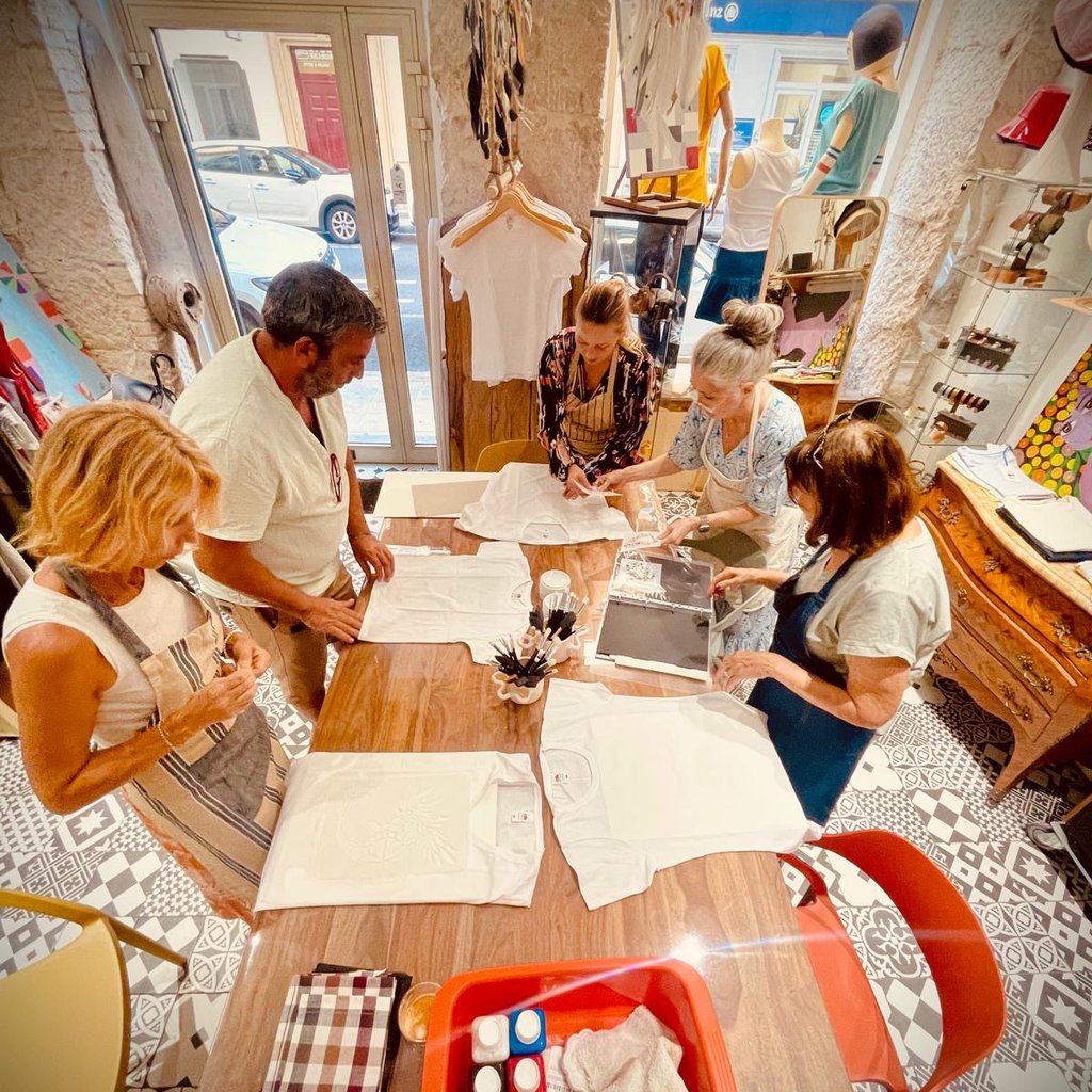White knitted shoes and a clear pouch with chloe logo.