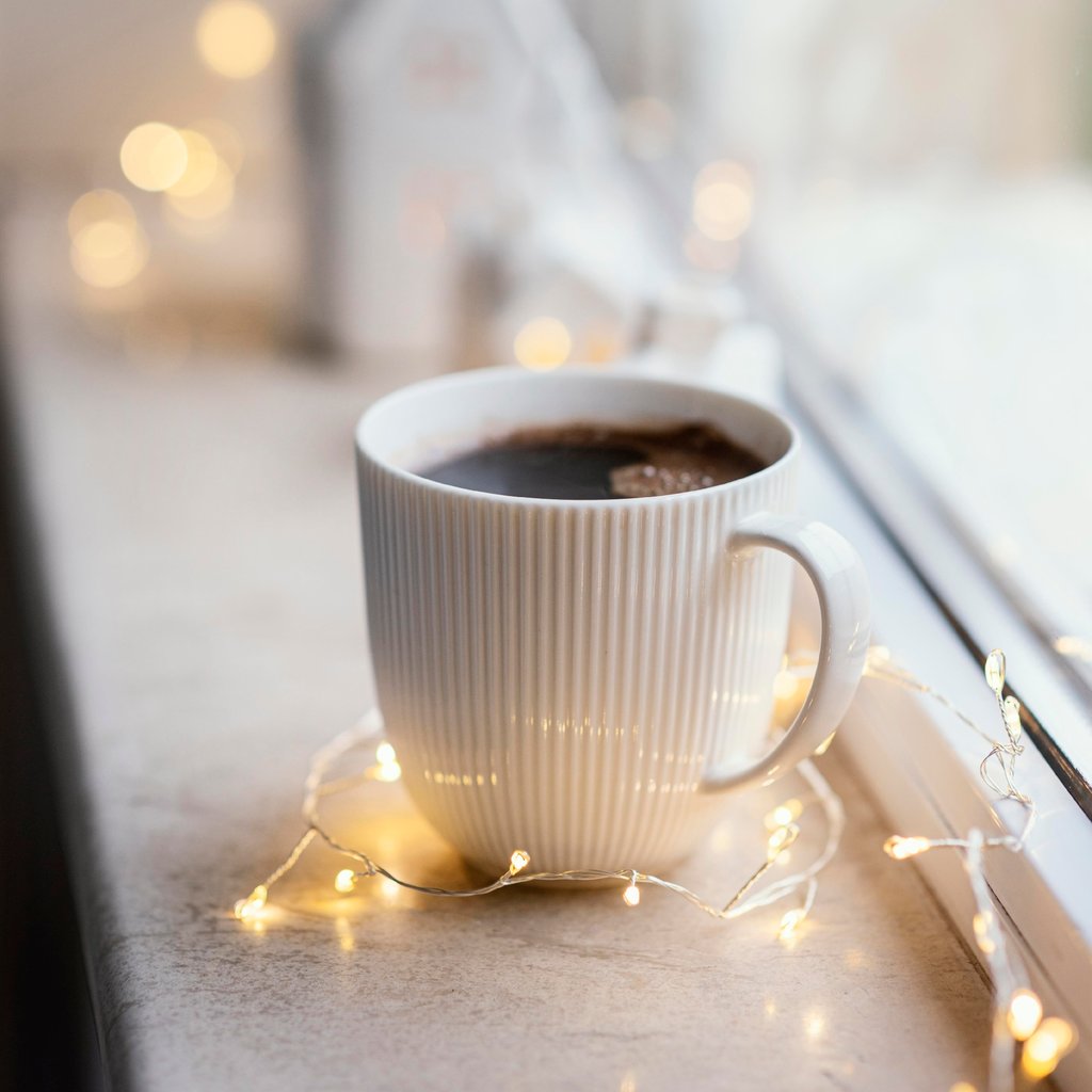 A coffee stand welcomes customers with its inviting shop.