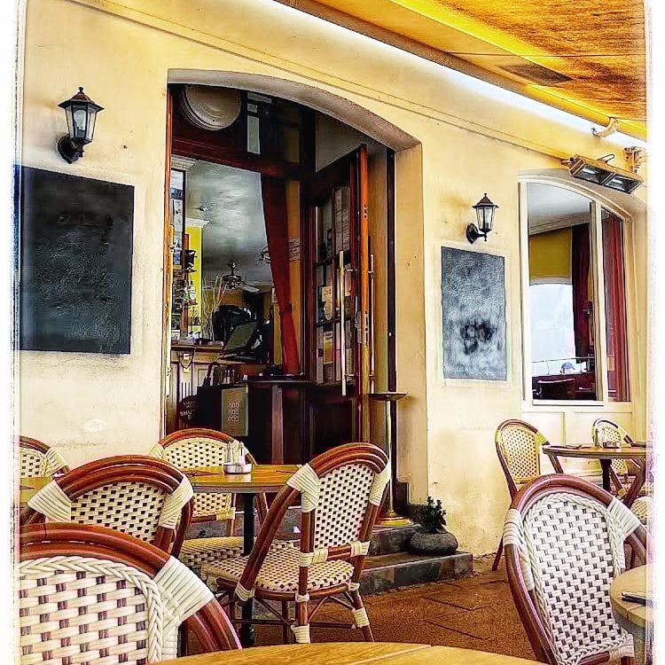 white ceramic mug on black and white table