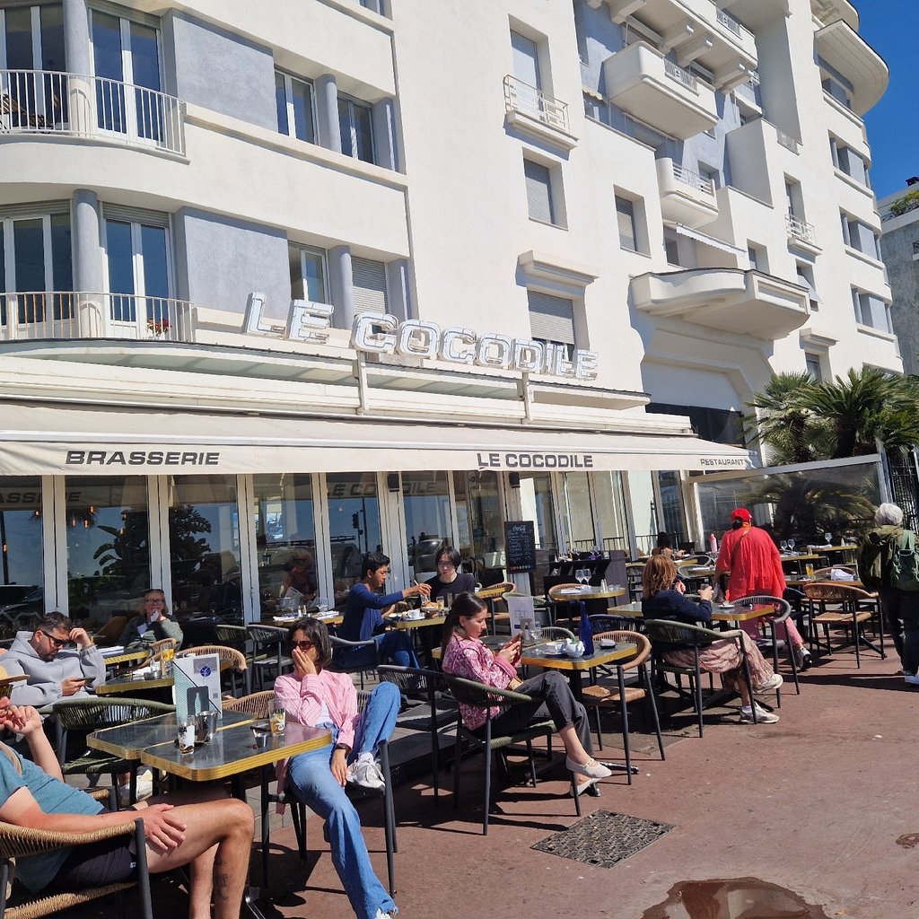woman in white shirt standing on stage
