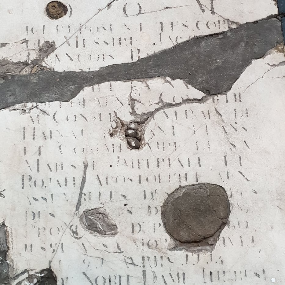 a table topped with lots of old maps