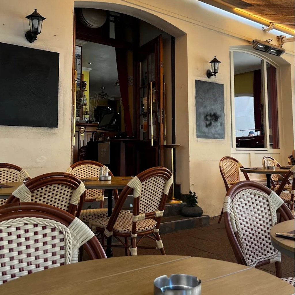 white ceramic mug on black and white table