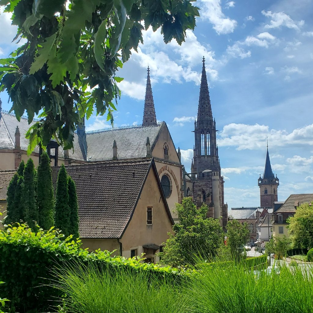 Traditional building with church tower under blue sky