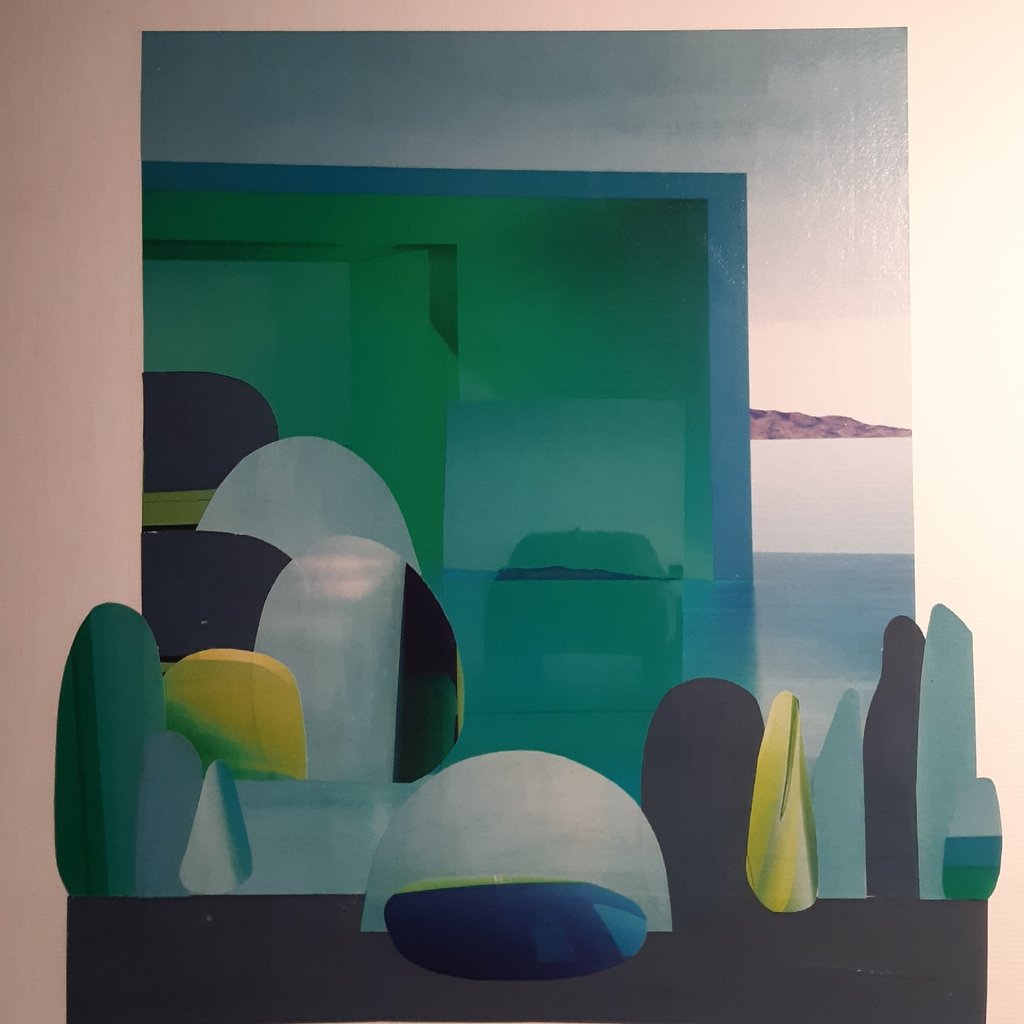 a collage of pictures and words on a white wall