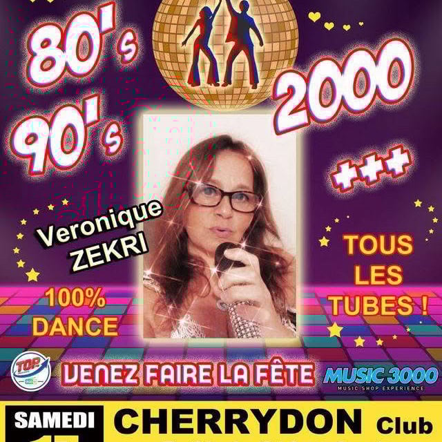 A woman standing on top of a stage in front of a crowd