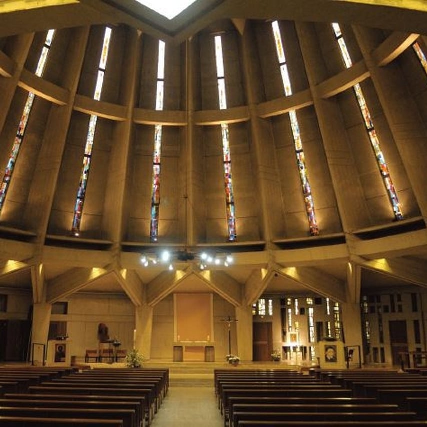a large pipe organ in a church with a clock