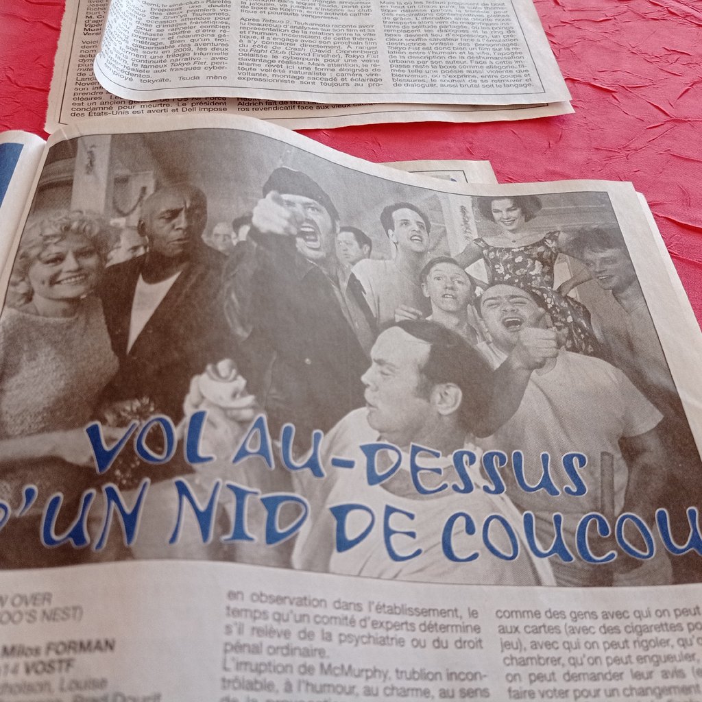 A person flying a kite on a sandy beach