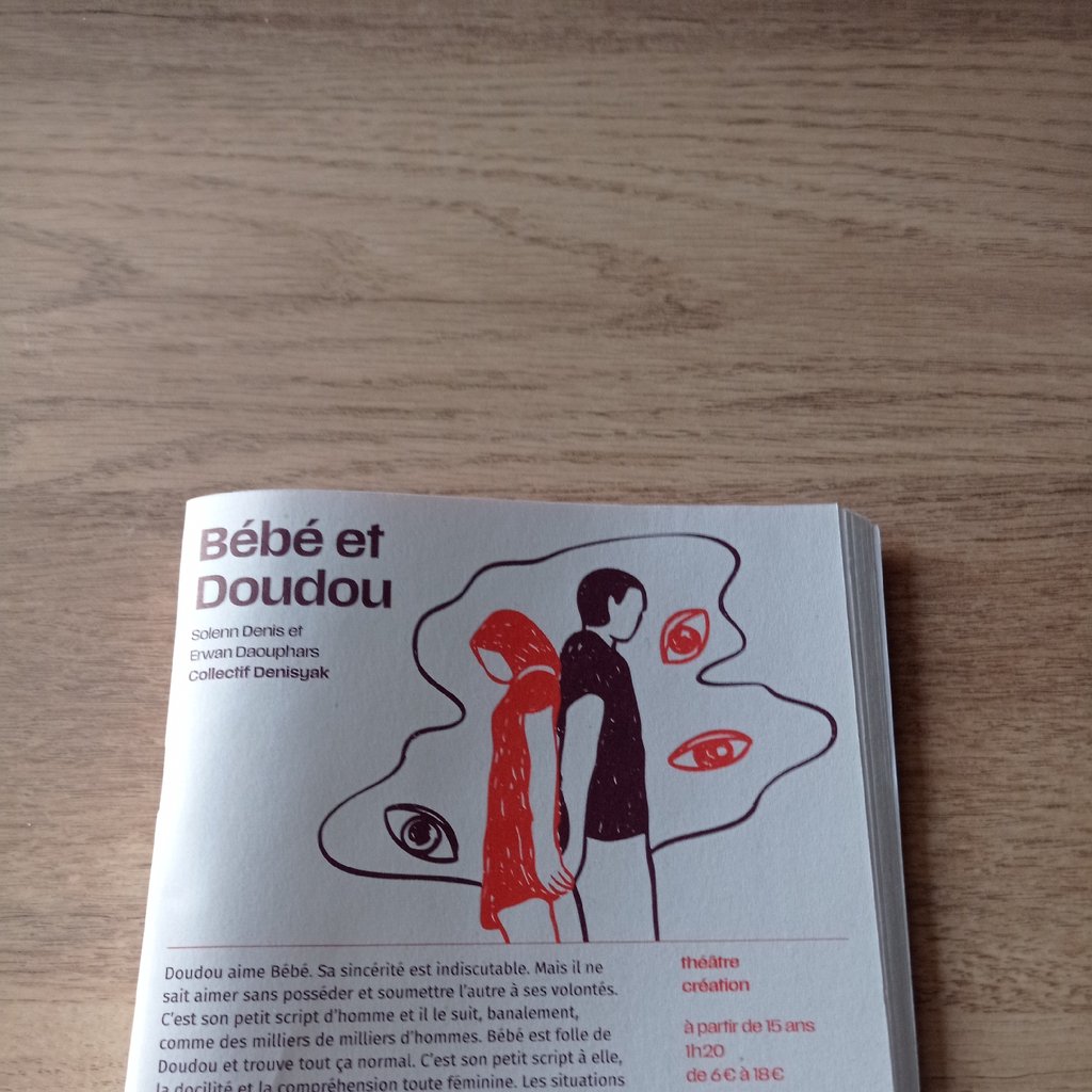 Stage with white curtains and dim lights.